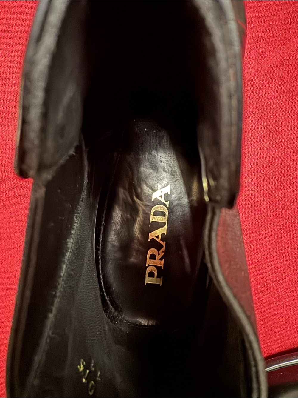 Prada Black Leather Slip-On with Gold Logo